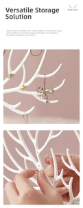 Detailed view of white antler jewelry stand with branches for hanging earrings and rings