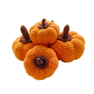 Set of four handmade crochet orange pumpkins with knitted texture for Halloween decor