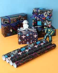 Detail showing neon gamer wrapping paper with video game controllers and pixel patterns