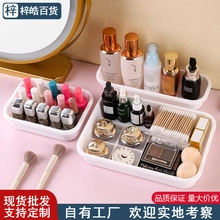 Three assorted sizes of white plastic desktop organizers for cosmetics and skincare