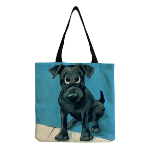Large capacity canvas tote bag with a blue background and a cute black dog art illustration