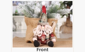 Front view of handmade Christmas gnome ornament with red and green plaid fabric details