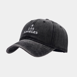 Detailed embroidery of 'A LOS ANGELES' on vintage washed black denim baseball cap