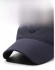 Close-up of a navy blue baseball cap showing reinforced stitching and a firm brim detail