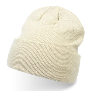 Macro view showing the soft ribbed texture of this cream knitted winter beanie hat