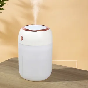 Mini umidificatore portatile bianco con bordo oro rosa e luce d'atmosfera calda