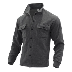 Detailed view of dark grey slim fit jacket with buttoned chest pockets and collar