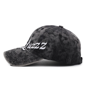 Vintage washed charcoal baseball cap with white side cursive embroidery and curved brim