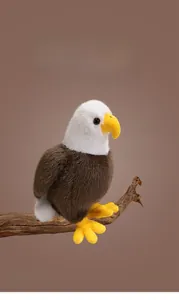 Realistic bald eagle plush toy with white head feathers and sharp yellow beak on branch