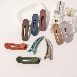 Macro view showing matte finish texture on colorful Morandi style hair clips set