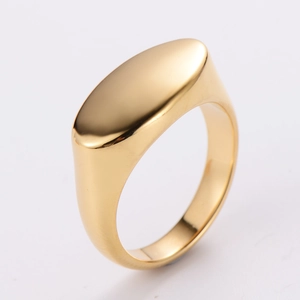 Polished gold minimalist signet ring with an oval flat top shown from a side profile view