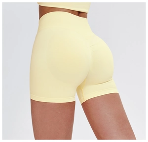 Close-up of seamless light yellow high-waisted shorts with scrunch butt lifting detail
