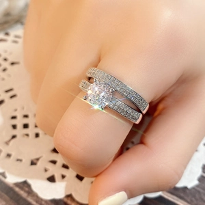 Elegant silver round-cut diamond wedding ring set for women with micro-pave crystals