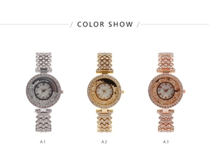 Three rhinestone-studded ladies watches in silver, gold, and rose gold colors