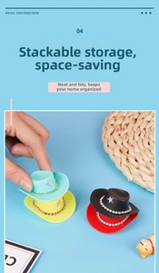 Detail of colorful mini doll cowboy hats with rhinestone edges and pink star decor