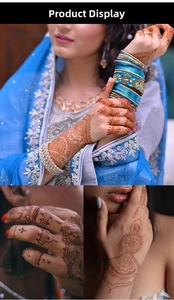 Detail of reddish-brown henna lace tattoo with intricate floral patterns on hand