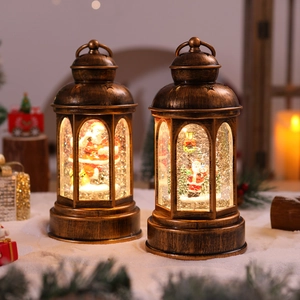 Detail of vintage bronze Christmas lantern with Santa figurines and warm LED lights