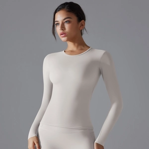 Close-up of the smooth neck and high-elastic fabric on this nude slim-fit yoga top