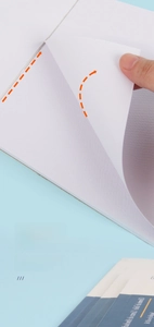 Detail of thick watercolor paper showing professional texture and rigid backing support