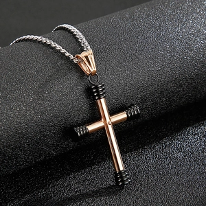 Rose gold stainless steel cross pendant necklace with black details on silver twist chain