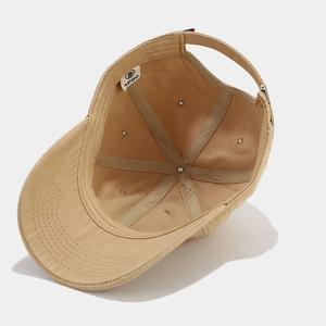 Inside view of khaki cotton BROOKLYN baseball cap showing premium lining and APDO label