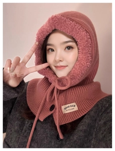 Detail of pink knitted balaclava hood with soft lamb velvet lining and brand tag