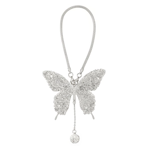 Detail of silver butterfly car mirror charm with sparkling rhinestones and mesh rope