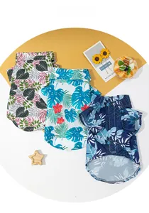 Detailed view of three tropical Hawaiian style dog shirts in diverse floral patterns