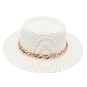 Close-up of white woven boater hat featuring a decorative thick gold chain link