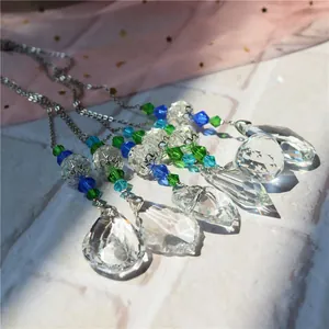 Detail of crystal suncatchers with faceted beads and prisms reflecting natural light