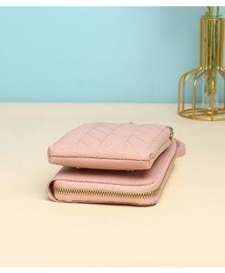 Detail view of pink PU leather phone bag with leaf-vein stitching and gold metal zipper