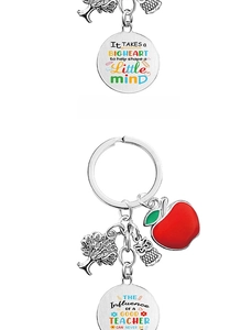 Detail of teacher appreciation keychain with owl and apple charms on stainless steel