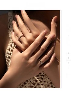 Detail of silver S925 ring set featuring micro-pave diamonds and twisted metal band