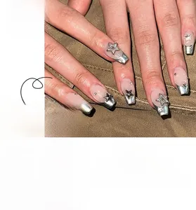 French ballerina press-on nails with nude pink base, silver 3D stars, and crystals