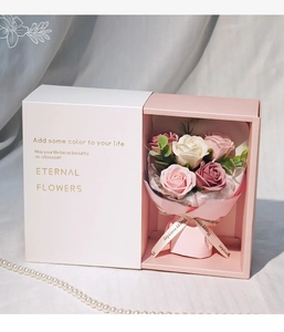 Detailed view of pink soap rose bouquet in drawer gift box with elegant pearl accents