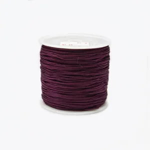 Close-up of 0.8mm dark purple braided nylon cord roll for DIY jewelry knotting