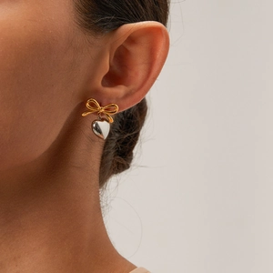 Elegant 18K gold bow and silver heart pendant earrings for women in dual-tone finish