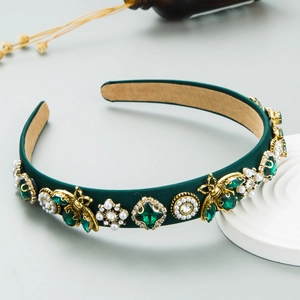 Detail of dark green satin headband with gold bee accents, rhinestones and pearls
