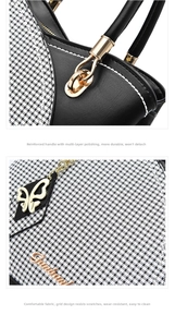 Detail of black leather handbag featuring gold butterfly charm and durable metal hardware