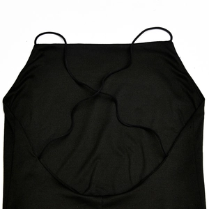 Close-up of black summer dress featuring crisscross backless straps and soft knit fabric