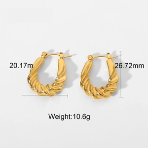 Detail view of twisted gold hoop earrings showing size 20x26mm and 10.6g weight