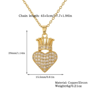 Detail view of heart pendant with crown in gold-plated copper and sparkling zircon stones