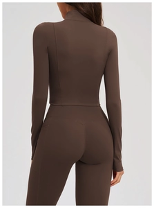 Back view of slim fit yoga jacket and leggings set with side pockets in coffee brown