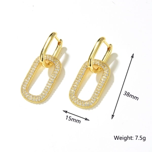 Detail view of gold U-shaped earrings with zircon pavé rectangles, 38mm height and 15mm width