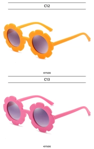 Detail view of sunflower shaped kids sunglasses in vibrant orange and sweet pink finishes