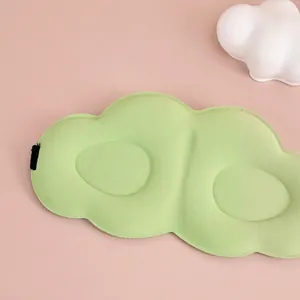 3D cloud sleep mask in light green silk featuring breathable ergonomic eye pockets