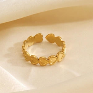 Minimalist 18K gold plated stainless steel open heart ring shown from a 45-degree angle