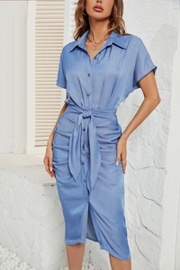Detailed view of blue denim short sleeve dress with waist tie and button front detail