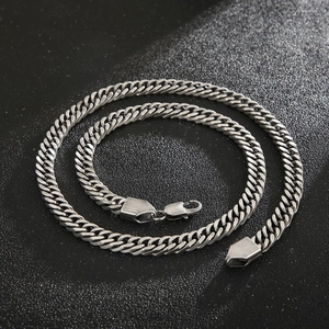 Detailed top view of matte stainless steel Cuban link necklace with lobster clasp closure