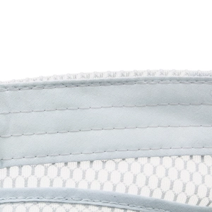 Close-up of breathable light gray honeycomb mesh fabric and durable double stitching